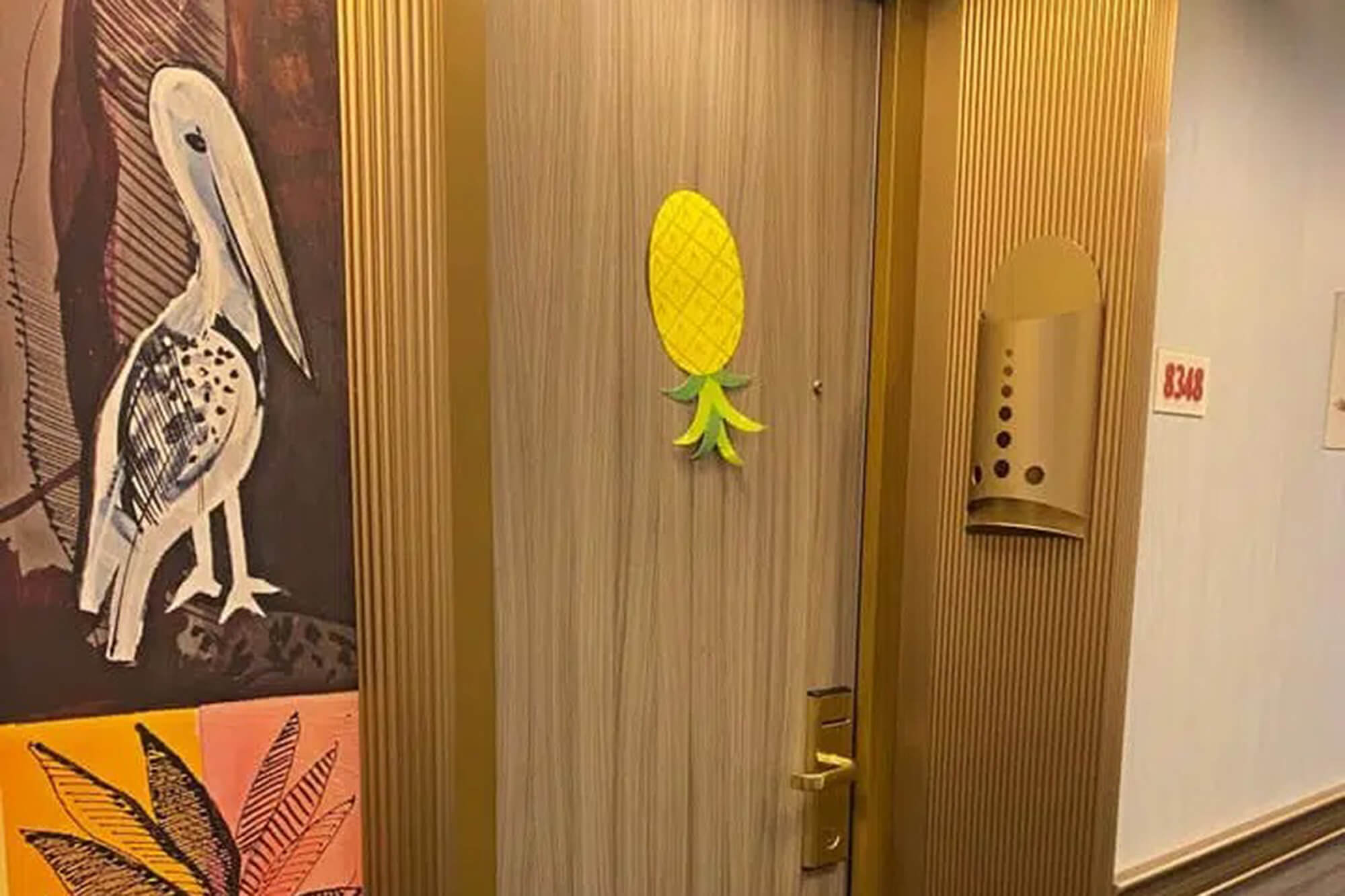 upside down pineapple on a door 